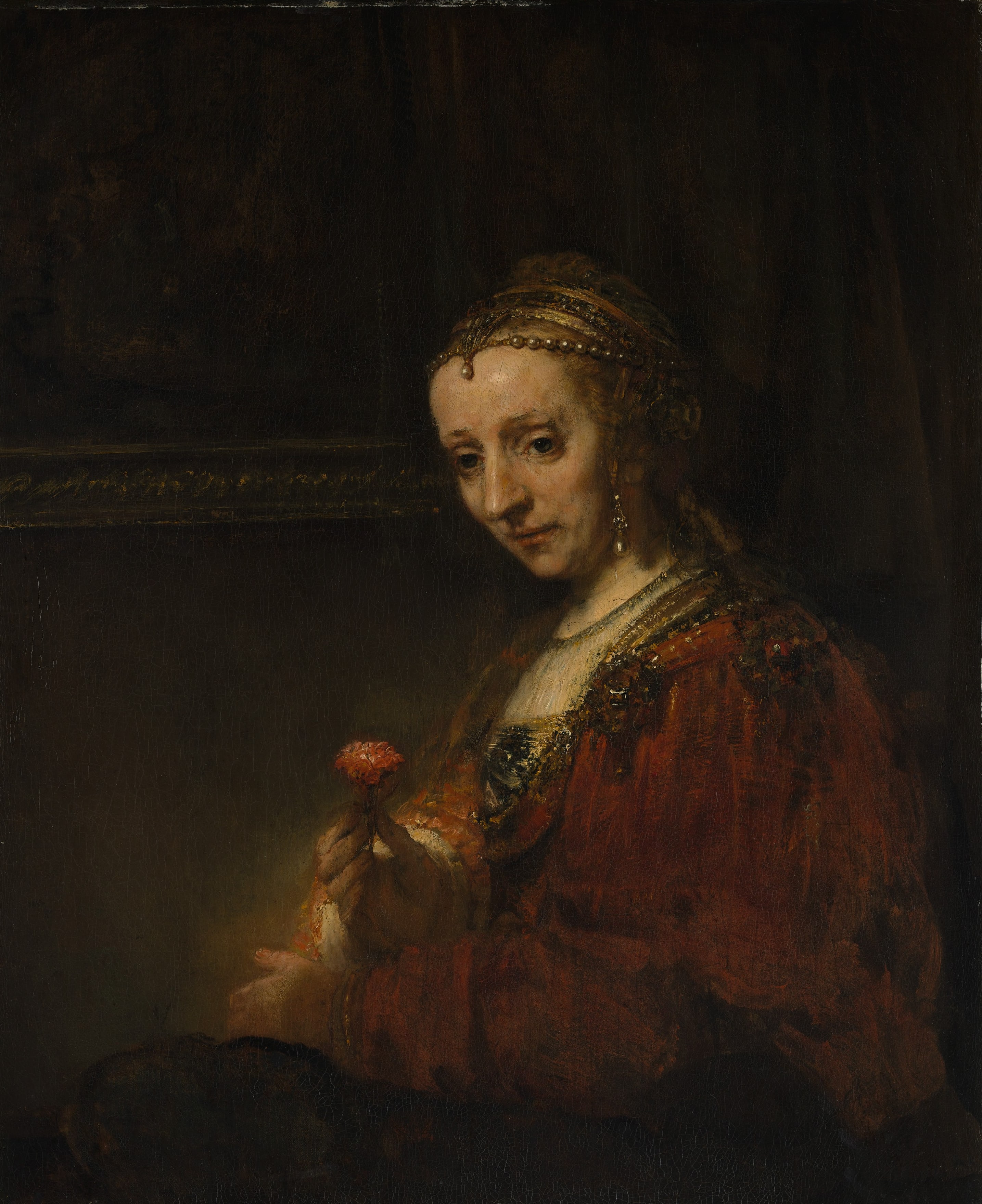 Woman with a Pink by Rembrandt (Rembrandt van Rijn)